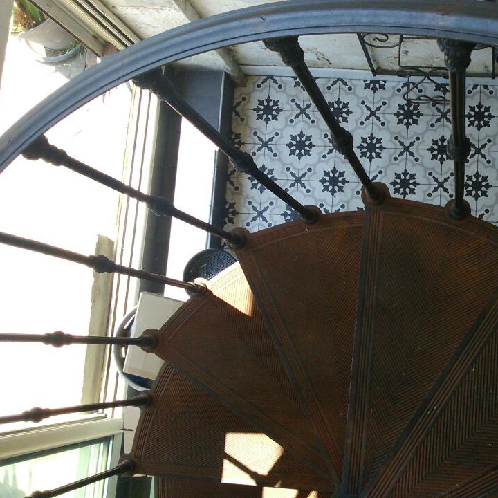 Cast iron spiral staircase model Reims in the Restaurant La Bourrique in La Grande-Motte (France)
